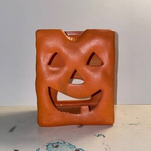 Ceramic pumpkin tea light candle holder.